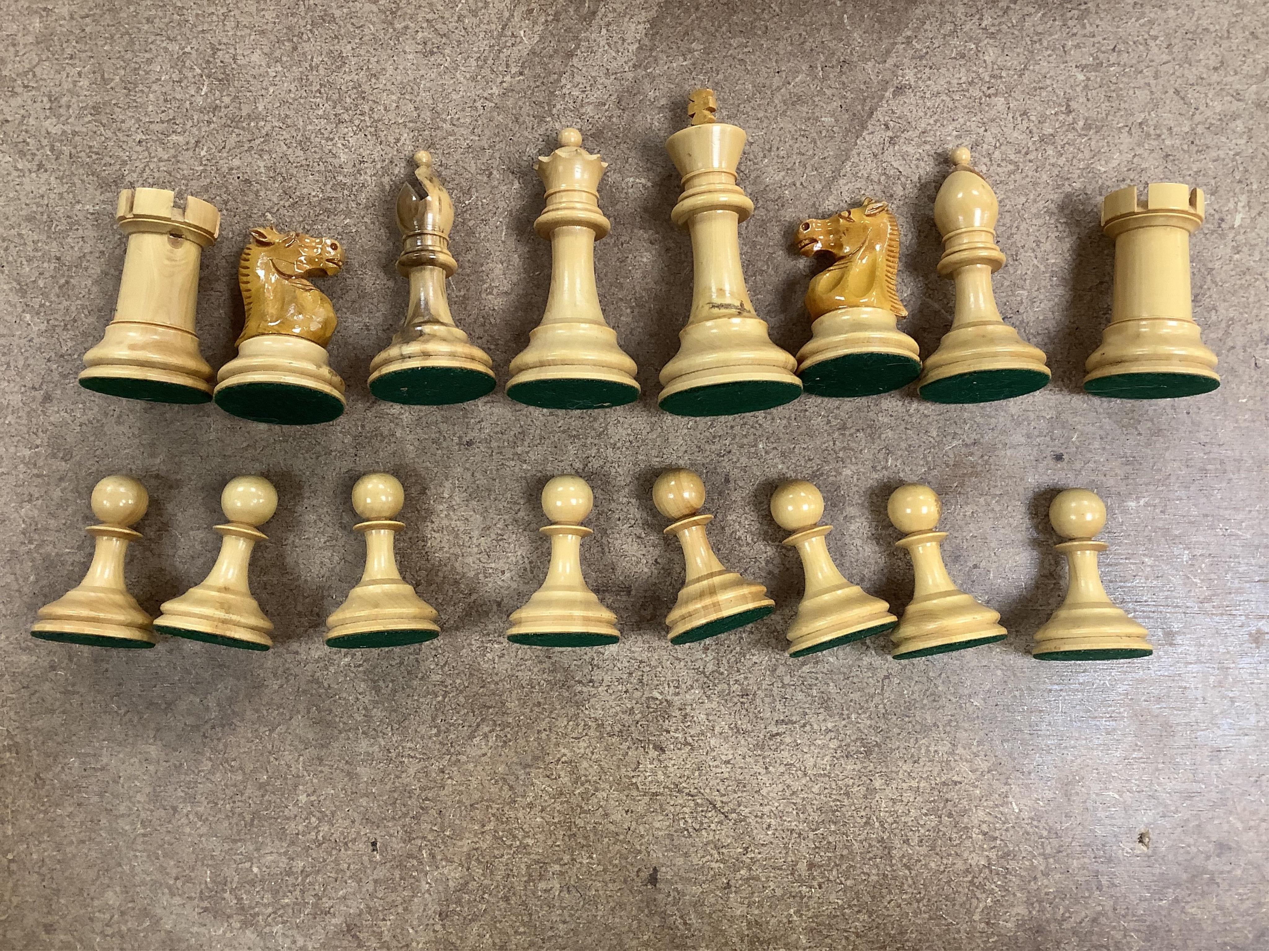 A turned wood and weighted Staunton pattern chess set, king 8cm tall. Condition - good and complete.